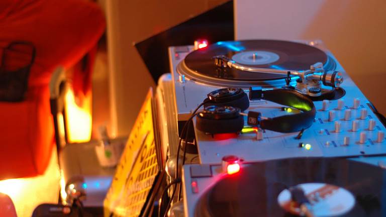 A DJ turntable and mixer. 