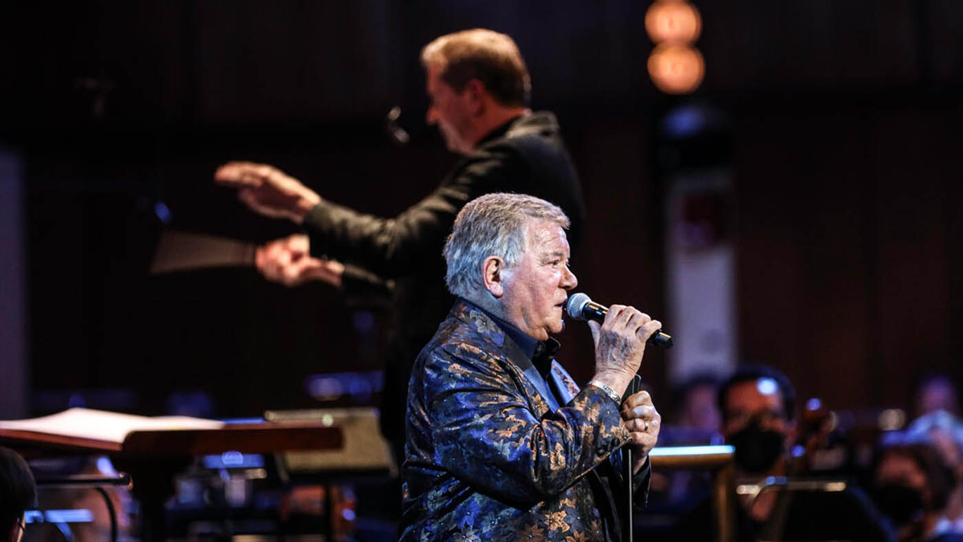 William Shatner singing with NSO while Steven Reineke  is conducting.