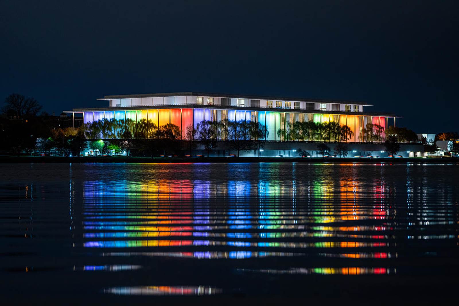 The John F. Kennedy Center for the Performing Arts lit up in the colors of the rainbow for the annual Honors celebration.